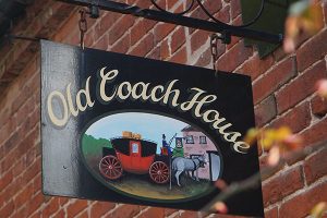 Old Coach House Outdoor Hanging Business Signage in Tampa, FL