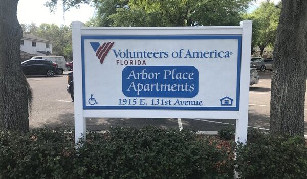 Outdoor sandblasted sign for Volunteers of America installed by Amazing Signs in Florida